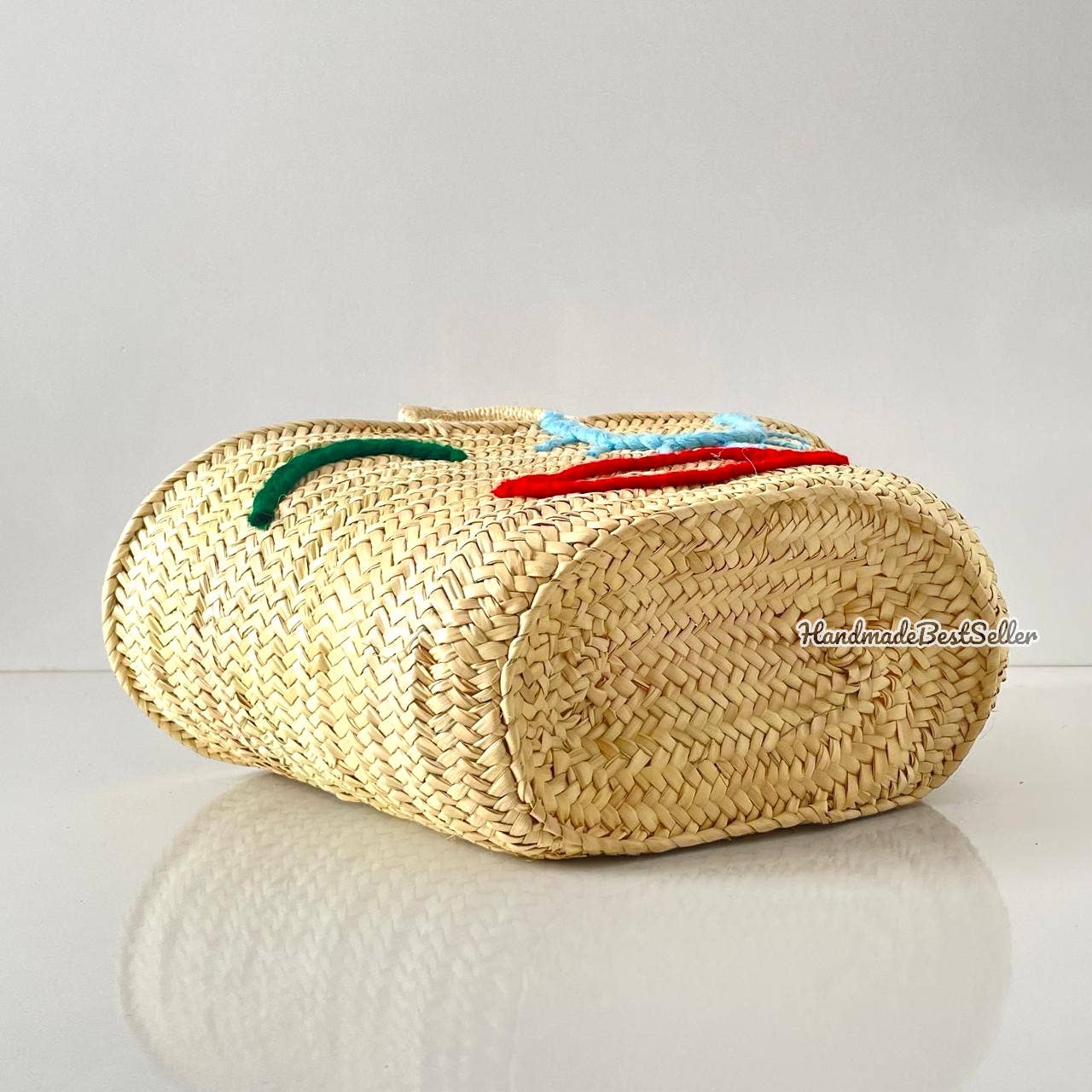 Beautiful handwoven straw bag with eye embroidery